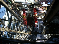 Crown Block being lowered to the drill floor 